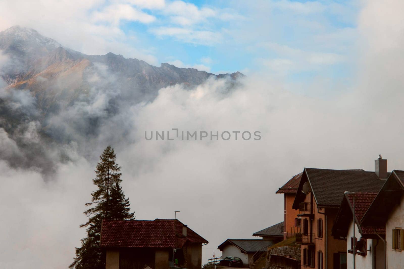 Clouds and Peaks: A Village Morning at the Foot of Whispering Alpine Giants by NadyaBeson
