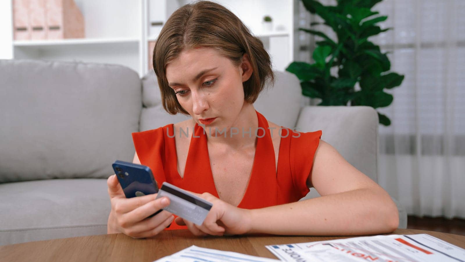 Stressed young woman has financial problems with credit card debt to pay prim from bad personal money and mortgage pay management crisis. Woman worry about financial bankruptcy risk from over spending