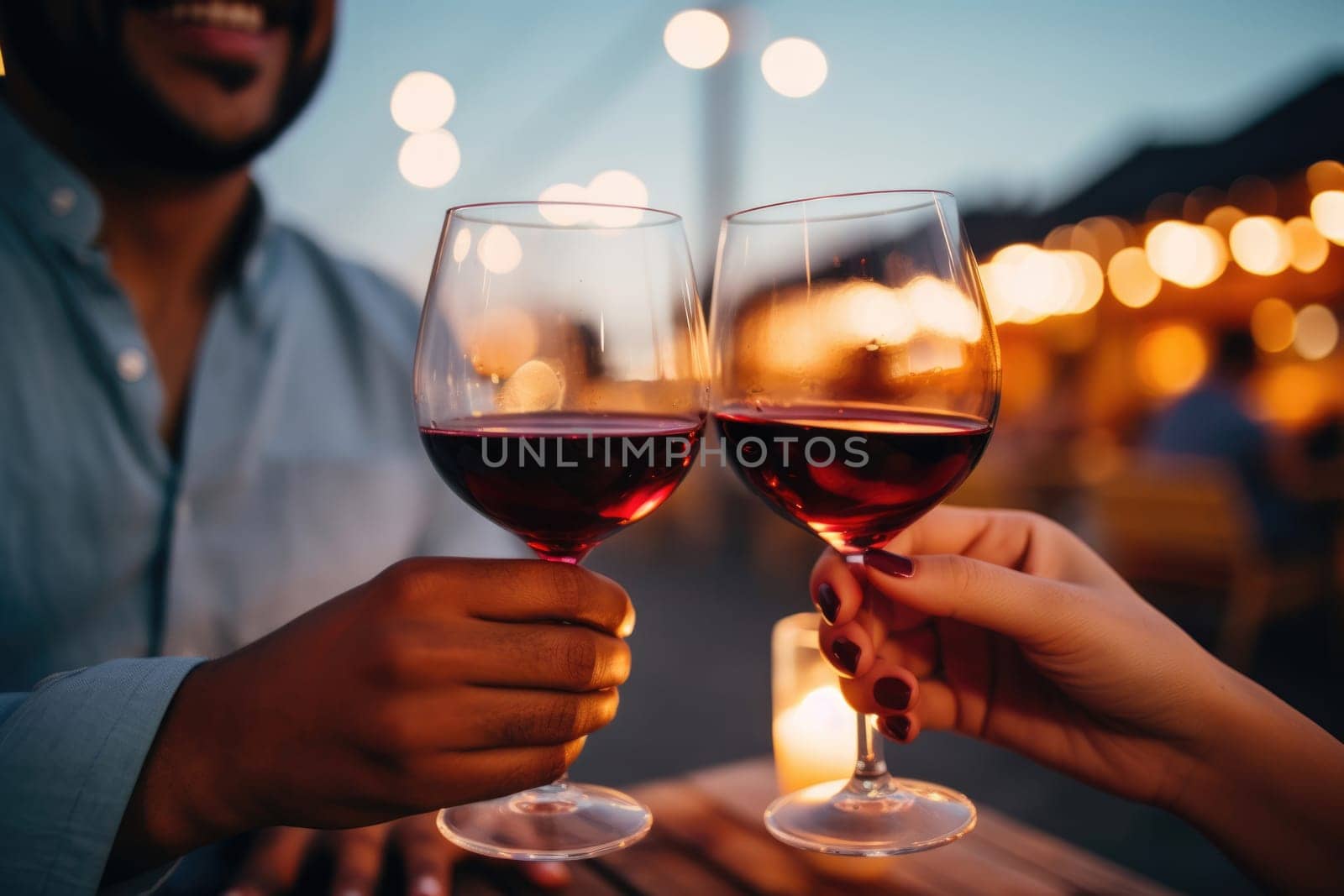 Hands holding glasses of red wine close up by ugguggu