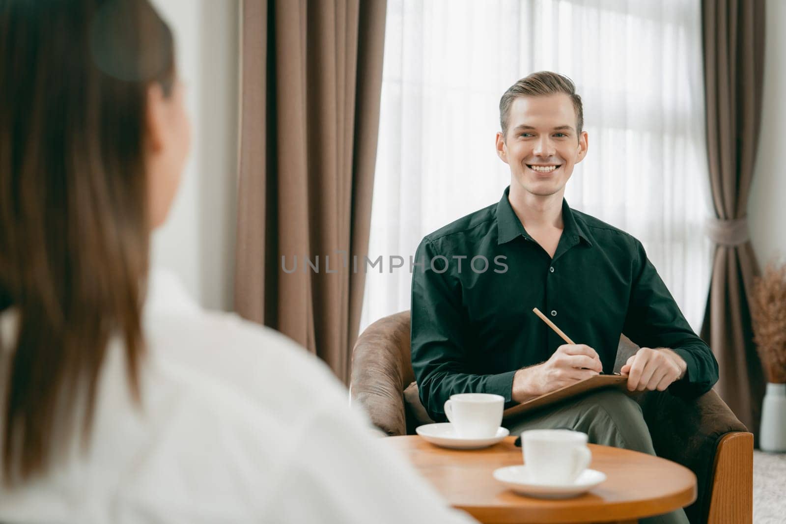 Psychological consultation gaining improvement on mental problem, happy young female patient doing therapy session while psychiatrist making diagnostic on mental illness. Unveiling