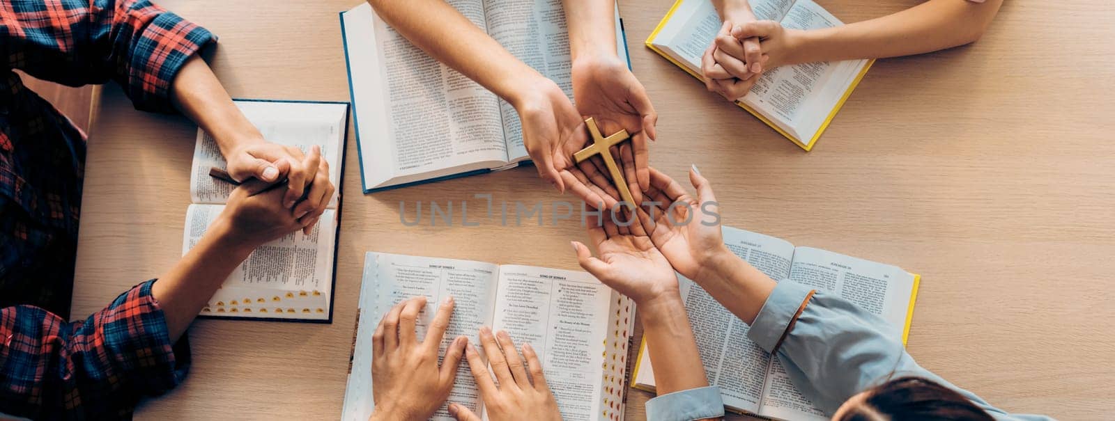 Close-up women prayer deliver holy bible book to believer group. Burgeoning. by biancoblue