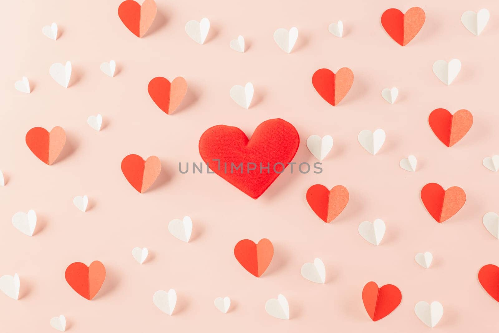 Happy Valentines Day background. Top view flat lay of paper elements cutting white and red hearts shape flying on pink background, Valentine Love day concept, Banner template design of holiday
