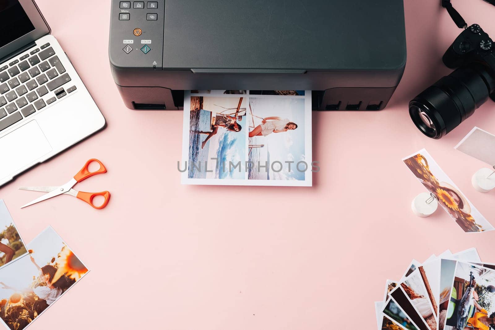 Printer, laptop and camera on the table close up. Printing photos