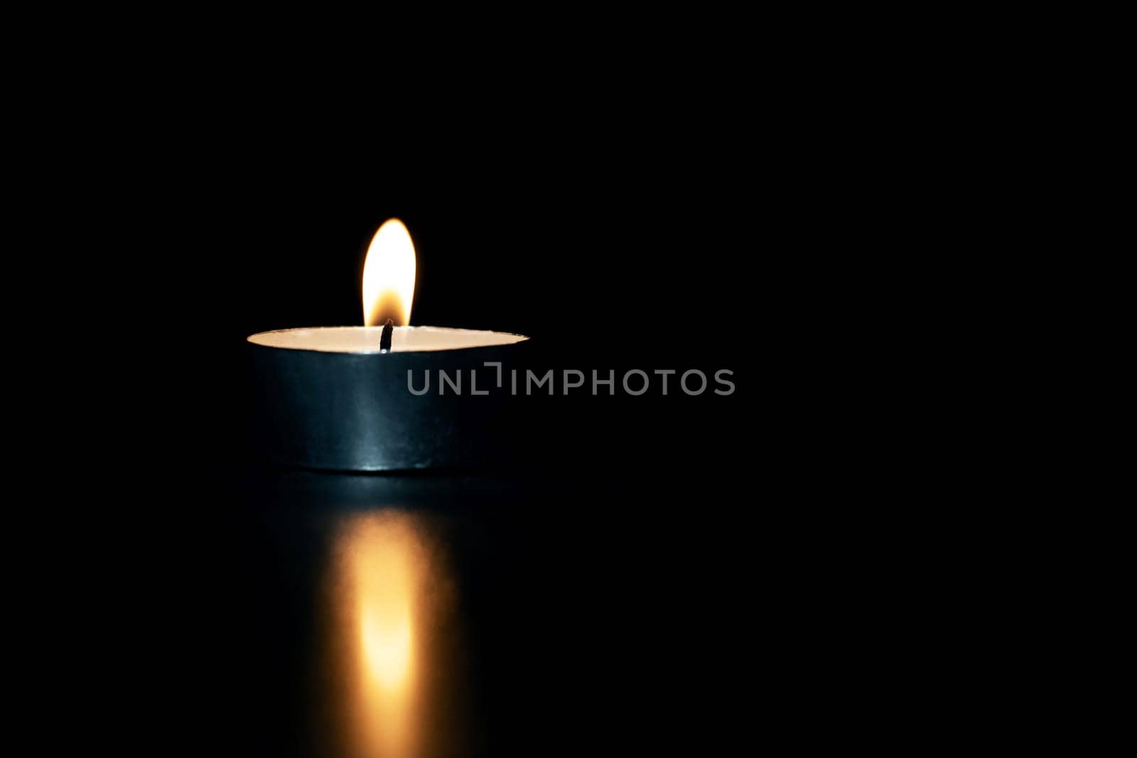 Burning candle in the dark with reflection by Vera1703