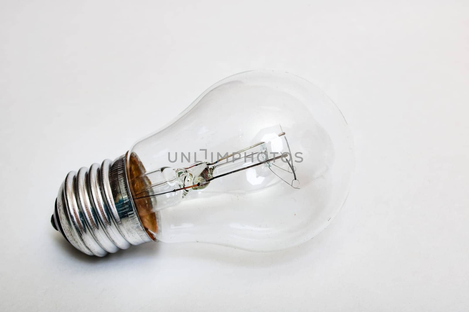 Old light bulb on a gray background close up