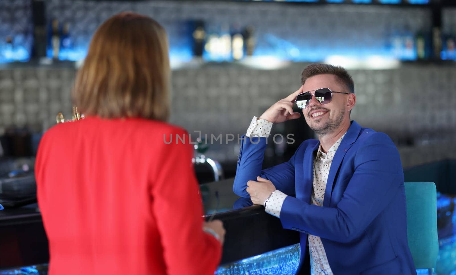Portrait of stylish dressed man meeting with woman colleague, go for drink in bar. Successful people on business meeting. Businesspeople, lunch concept