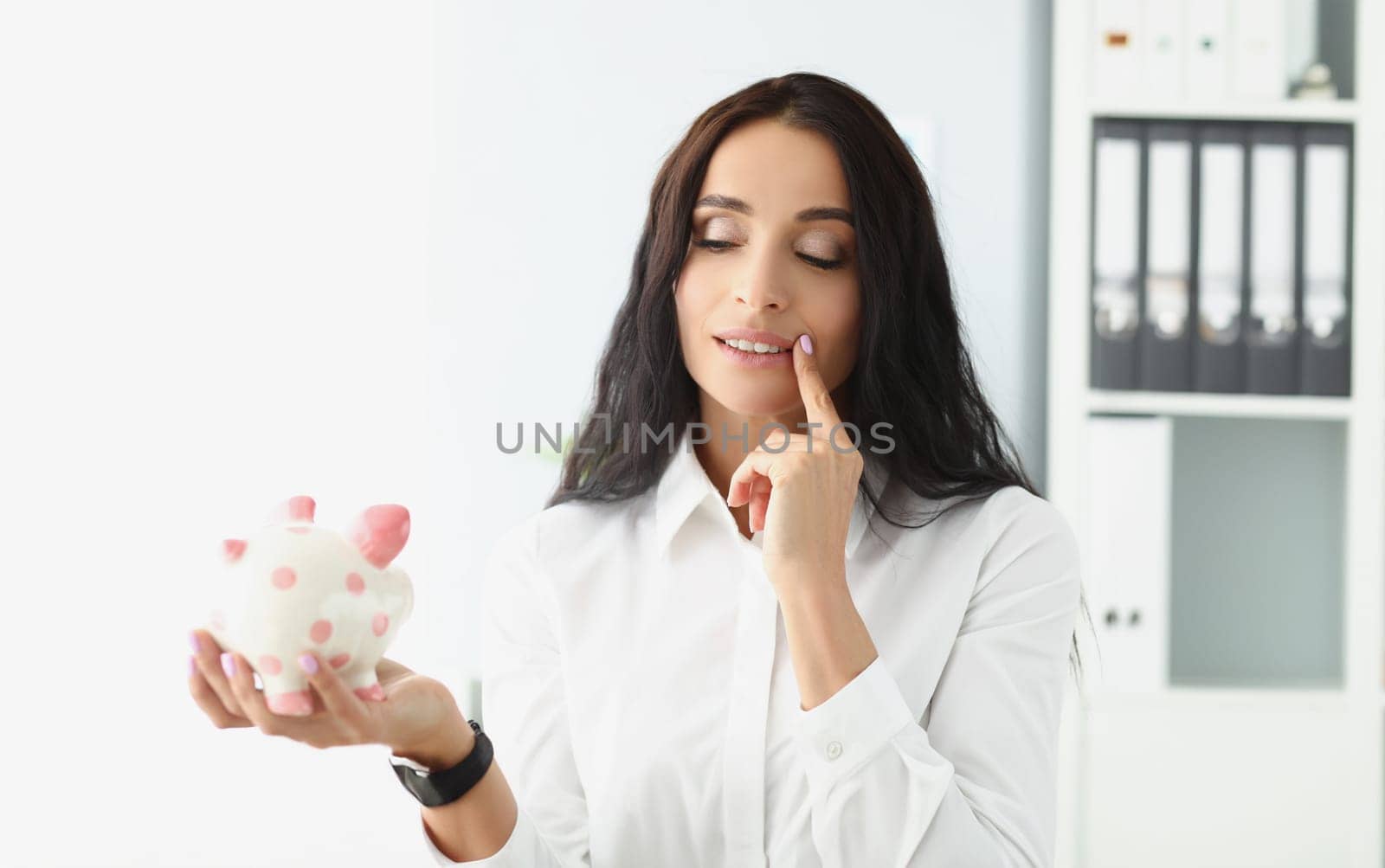 Portrait of woman hold piggybank, think of better way to use money, saving up for future. Female saving for shopping. Investment, saveup, finance concept