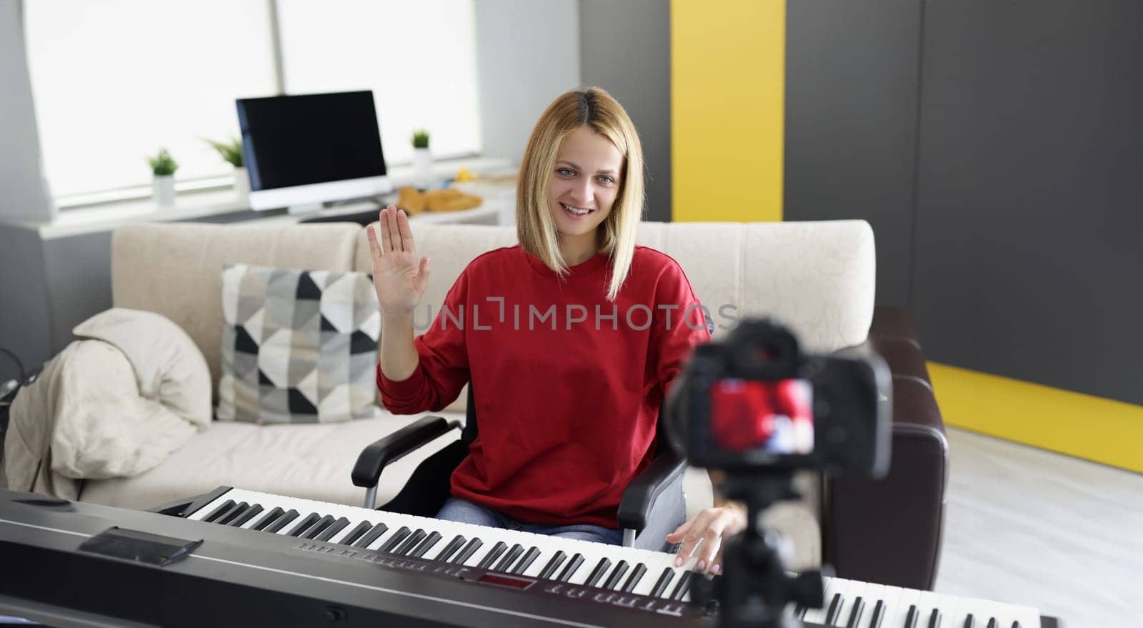 Portrait of disabled woman in wheelchair play piano on camera, talented pianist present her art for social media. Start blog, music, creativity concept