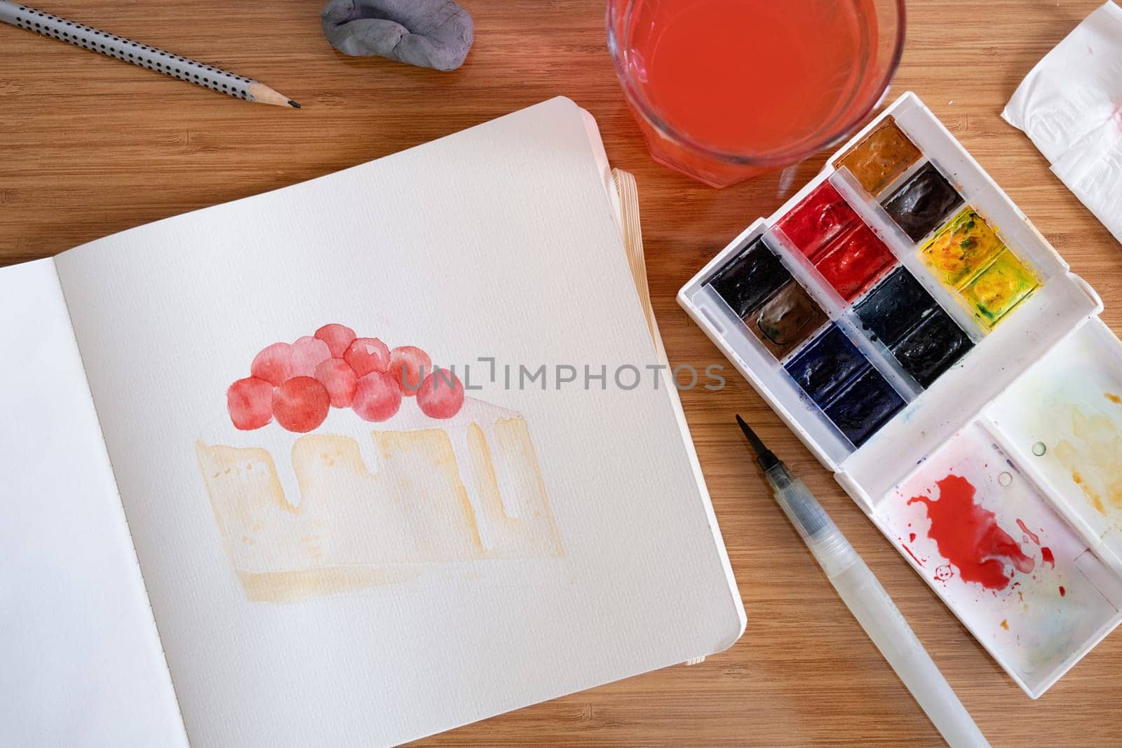 Hobbies and leisure. unrecognizable woman drawing watercolor on hotel room table