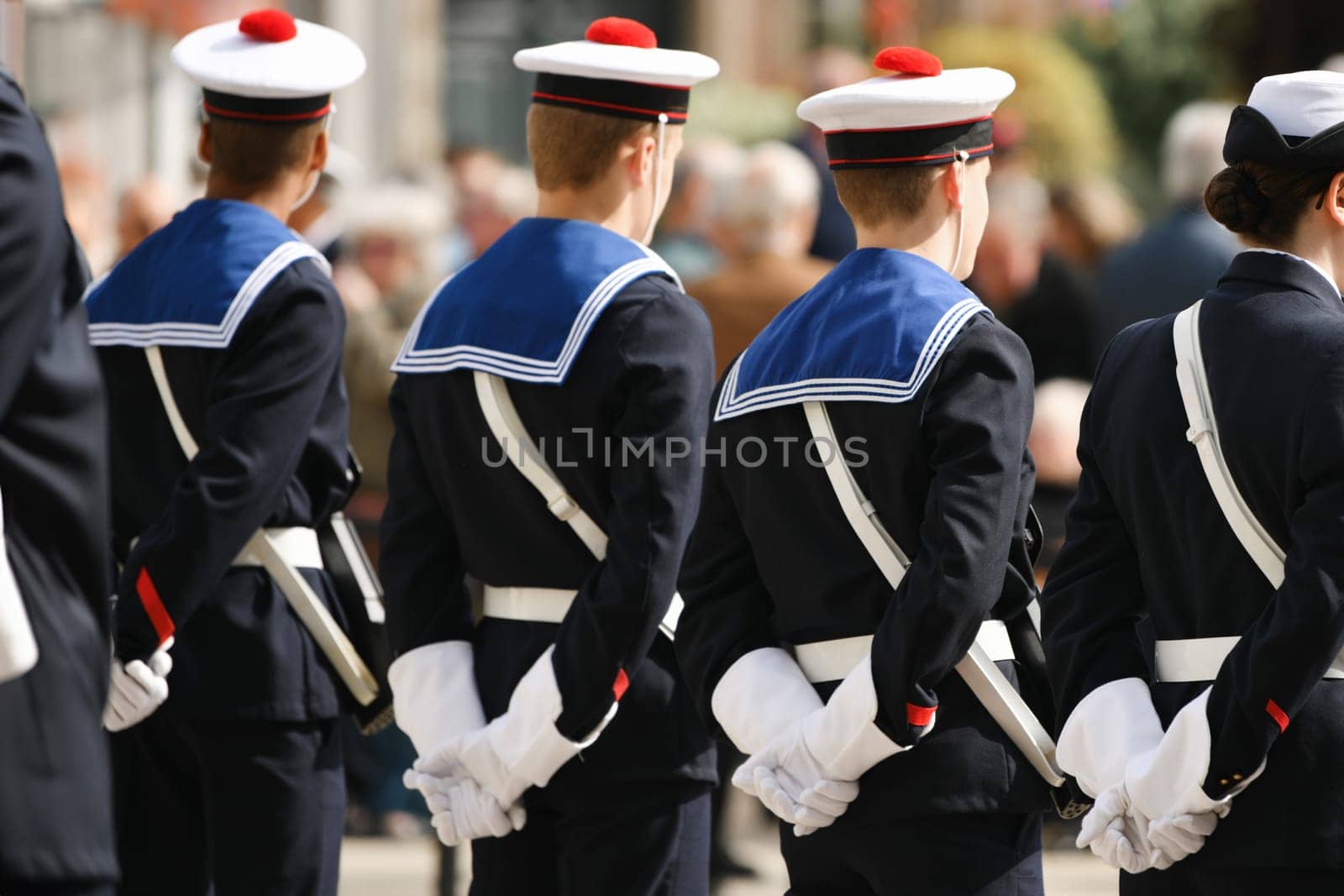 French sailors in white gloves and berets with a red pom-pom. french marine cap. 8 May