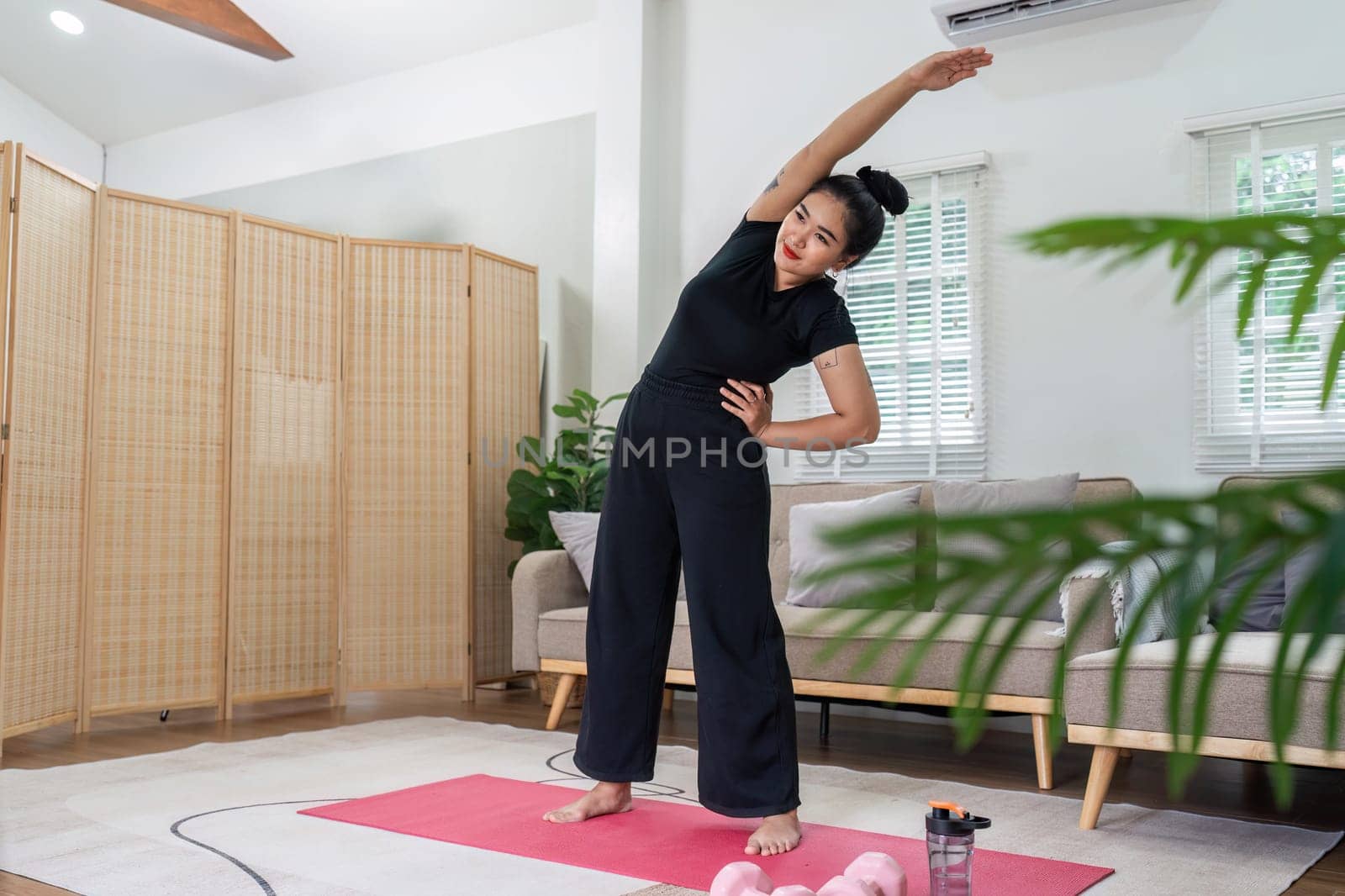 Fat women exercise healthily at home on leisurely day happily. overweight wellness at home concept.