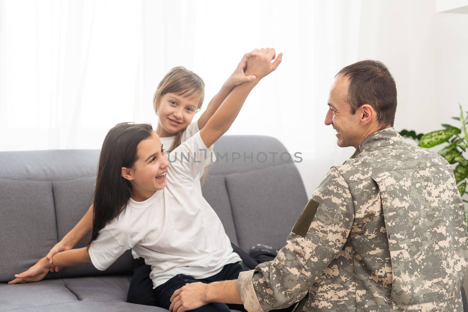 Little girl with her military father at home by Andelov13