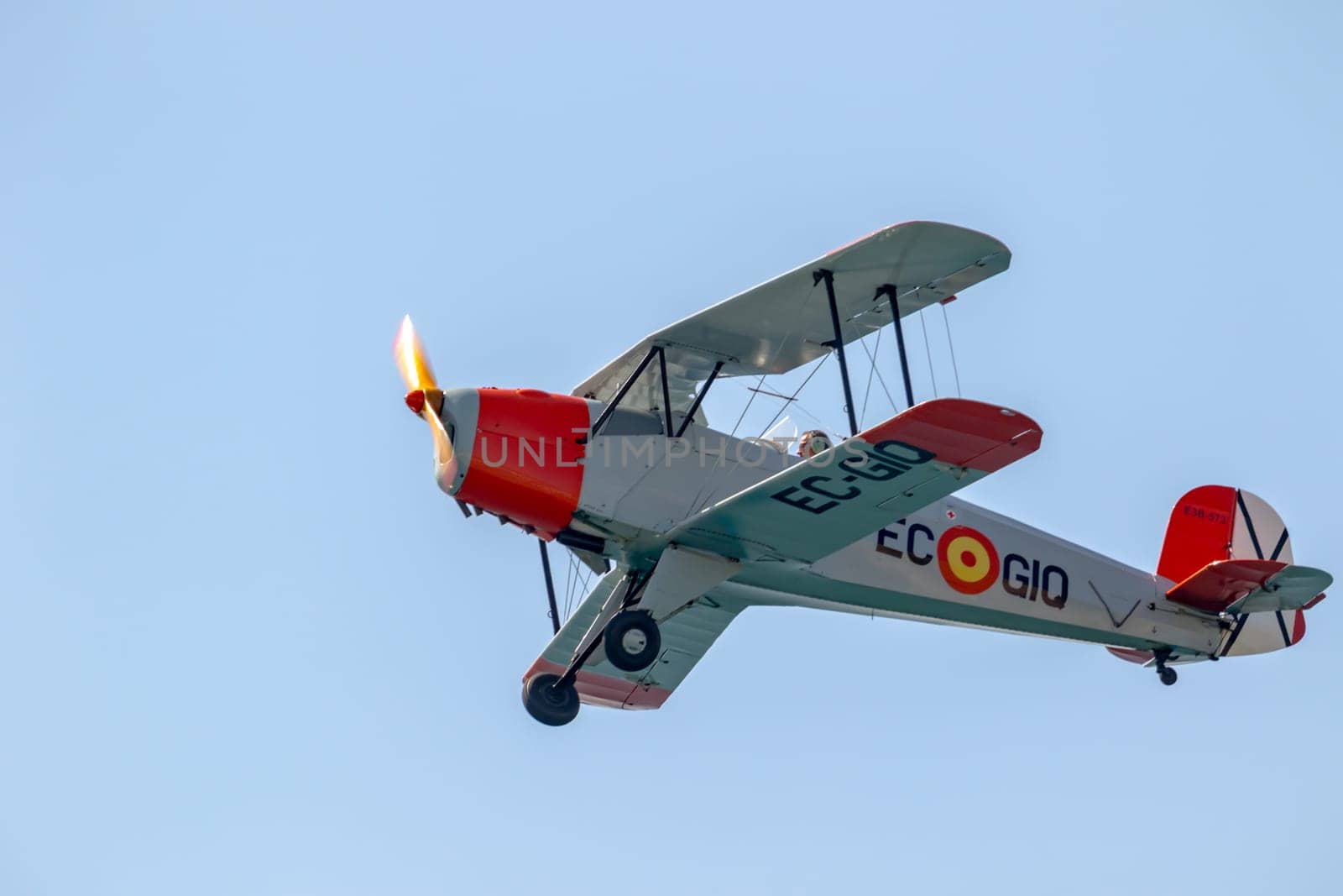 TORRE DEL MAR, MALAGA, SPAIN-JUL 30: Airplane CASA Bucker 1.131E Jungmann taking part in a exhibition on the 2nd airshow of Torre del Mar on July 30, 2017, in Torre del Mar, Malaga, Spain