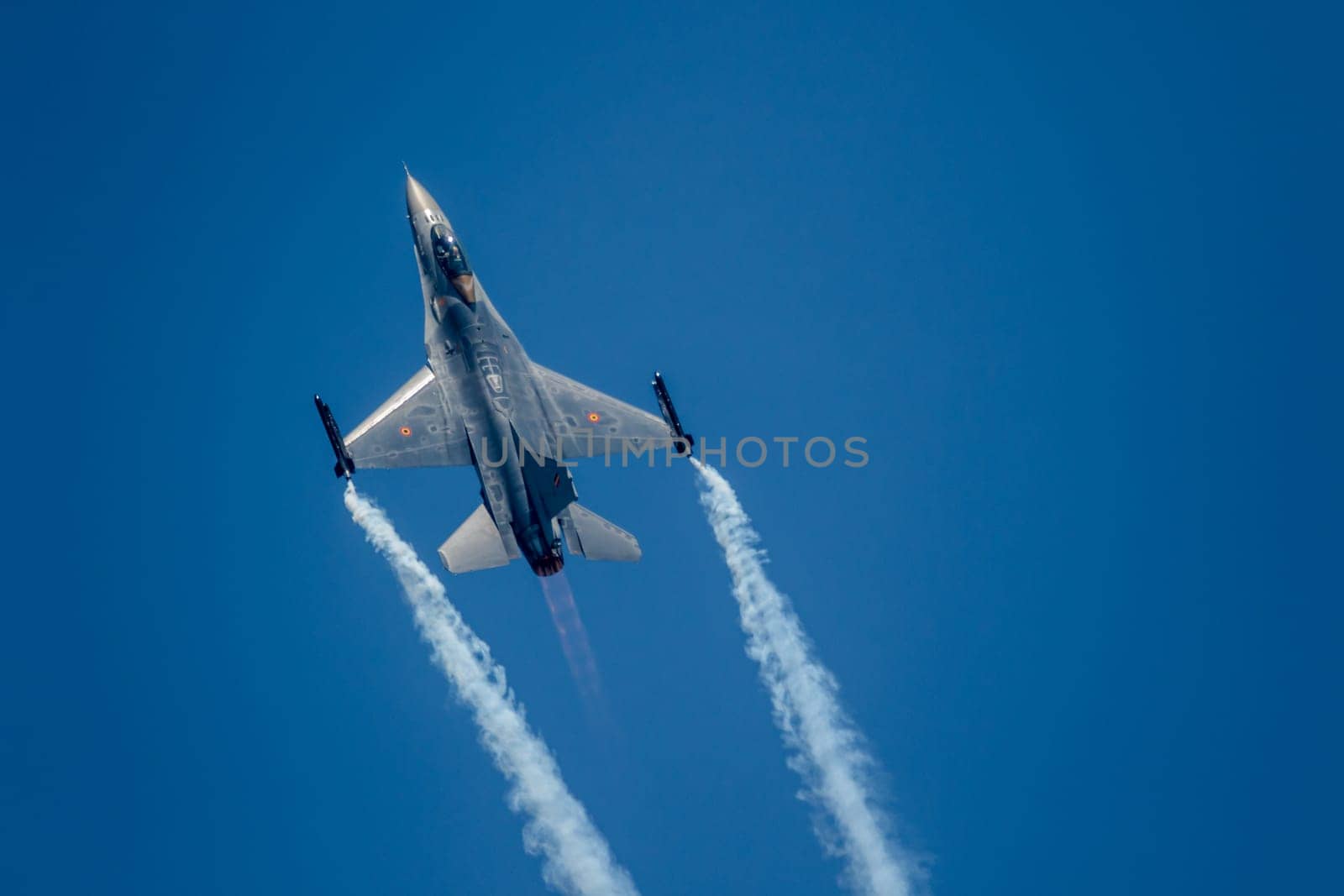 TORRE DEL MAR, MALAGA, SPAIN-JUL 28: Aircraft F-16 Belgian solo display taking part in a exhibition on the 2nd airshow of Torre del Mar on July 28, 2017, in Torre del Mar, Malaga, Spain