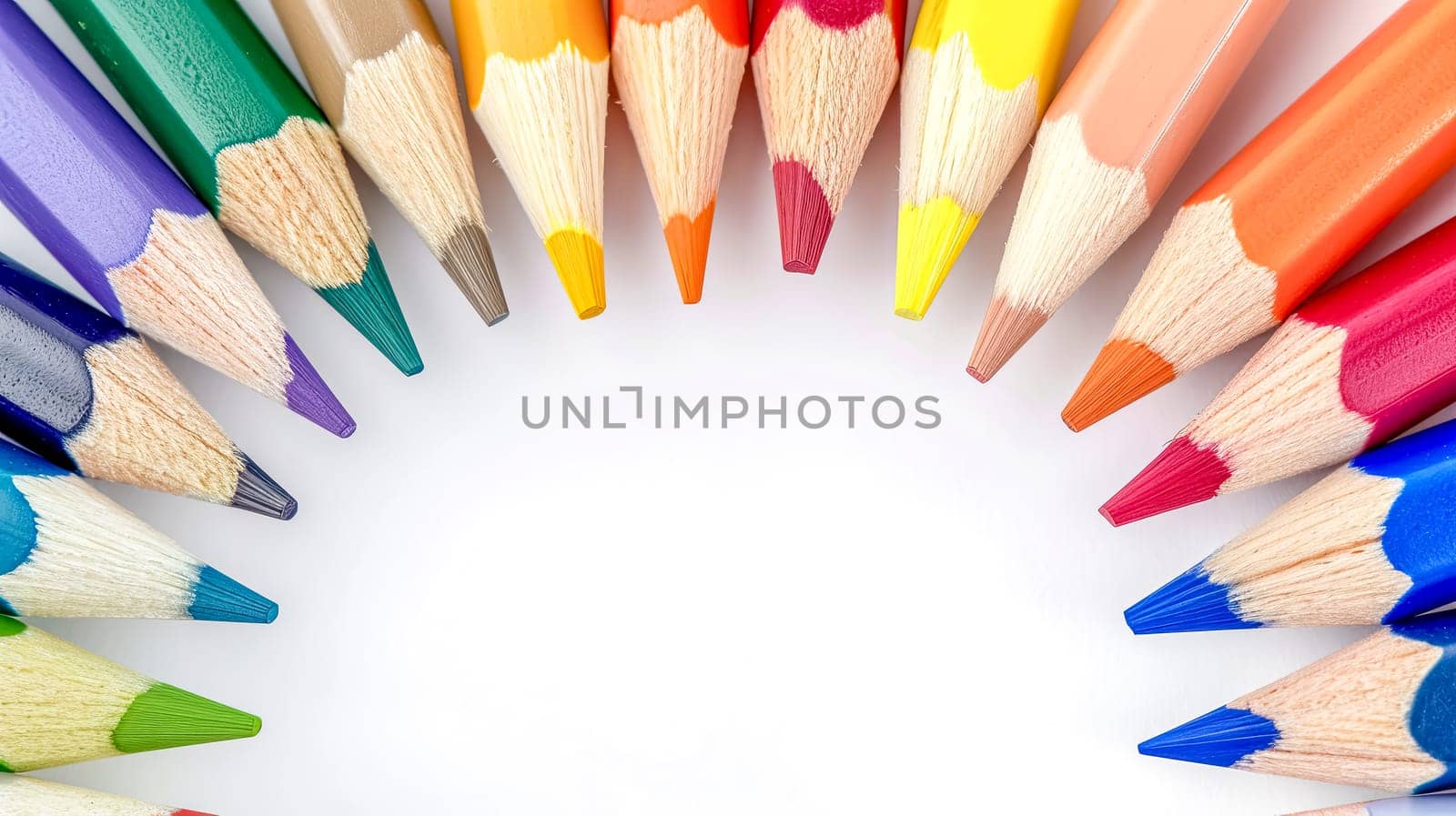 semicircle of sharpened colored pencils with tips pointing inward, displaying a spectrum of colors against a bright white background, symbolizing creativity and artistic potential, copy space