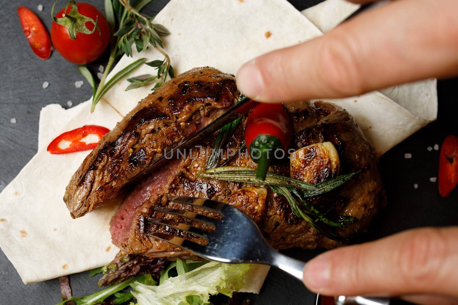 steak on the board, restaurant meat hand. High quality photo