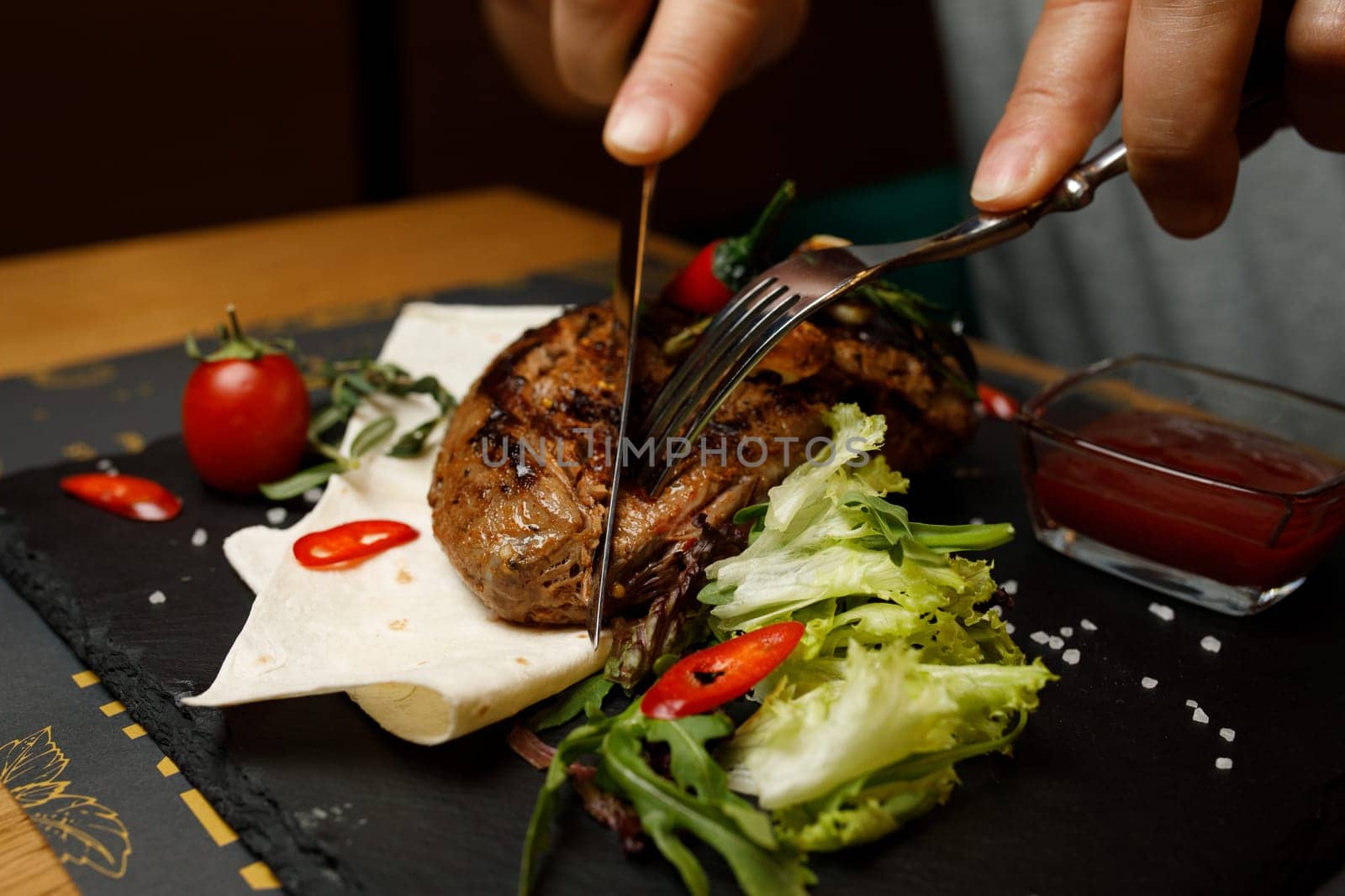 steak on the board, restaurant meat hand. High quality photo