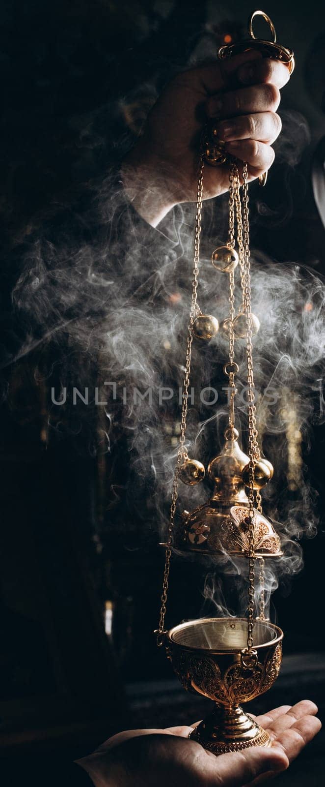 censer in the hands of the priest. High quality photo