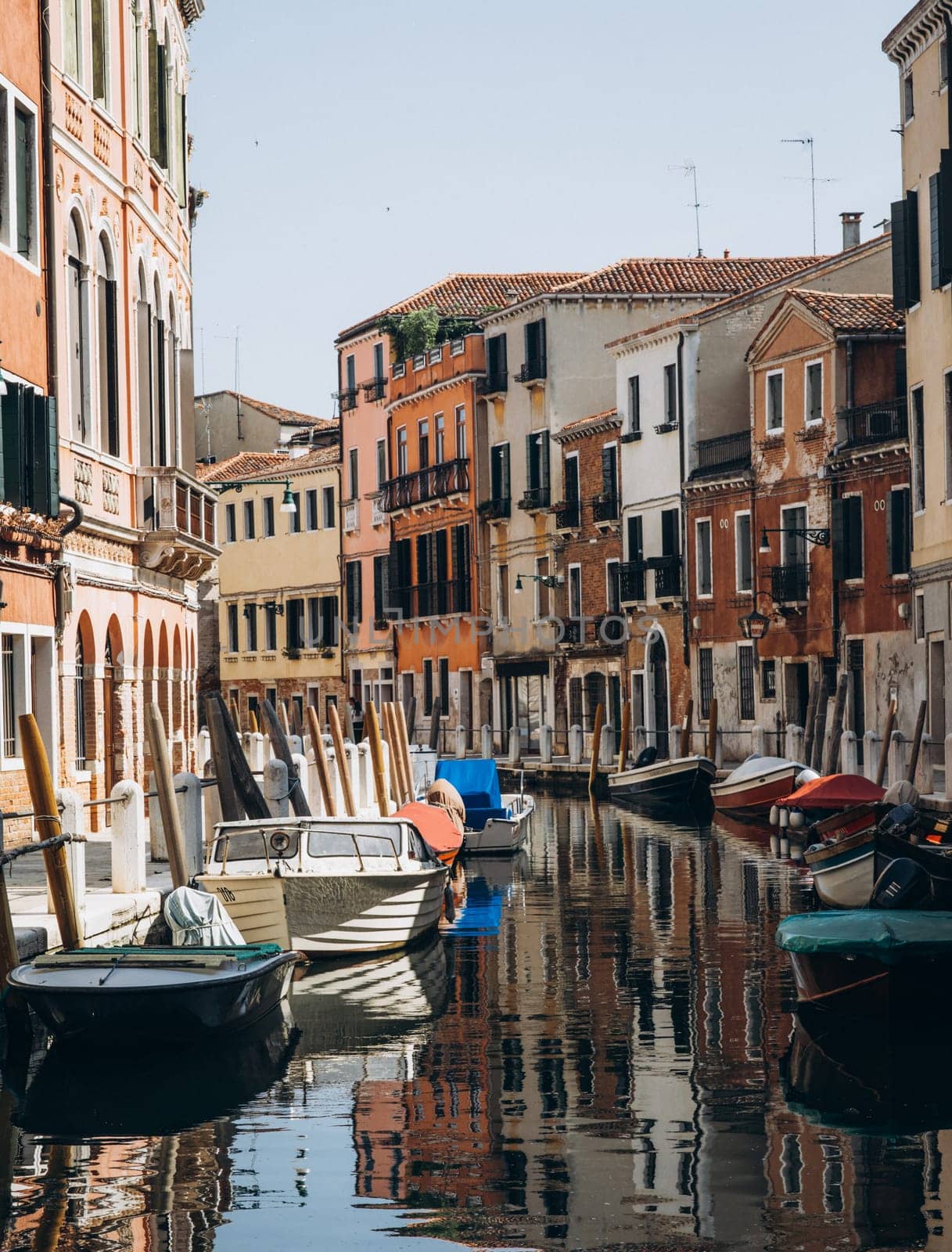 Venice narrow canal gondolas and boats. High quality photo