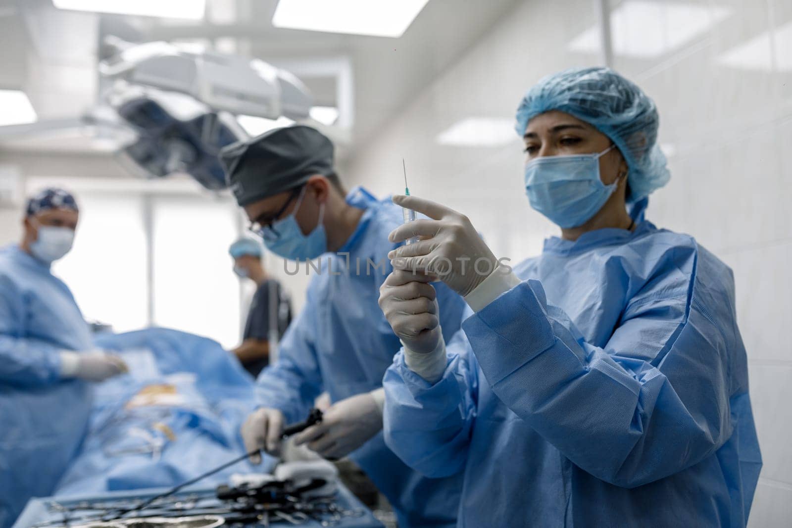 operating room doctors perform an injection operation. High quality photo
