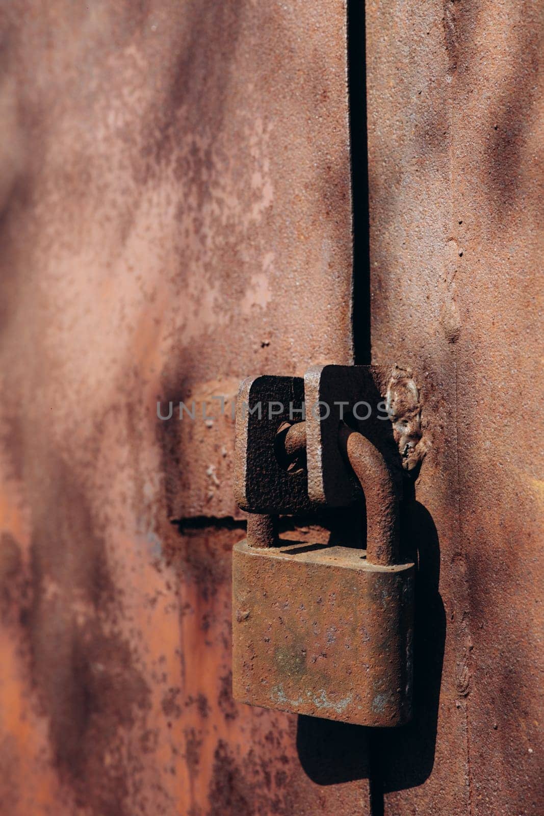 a rusty lock on the door. High quality photo