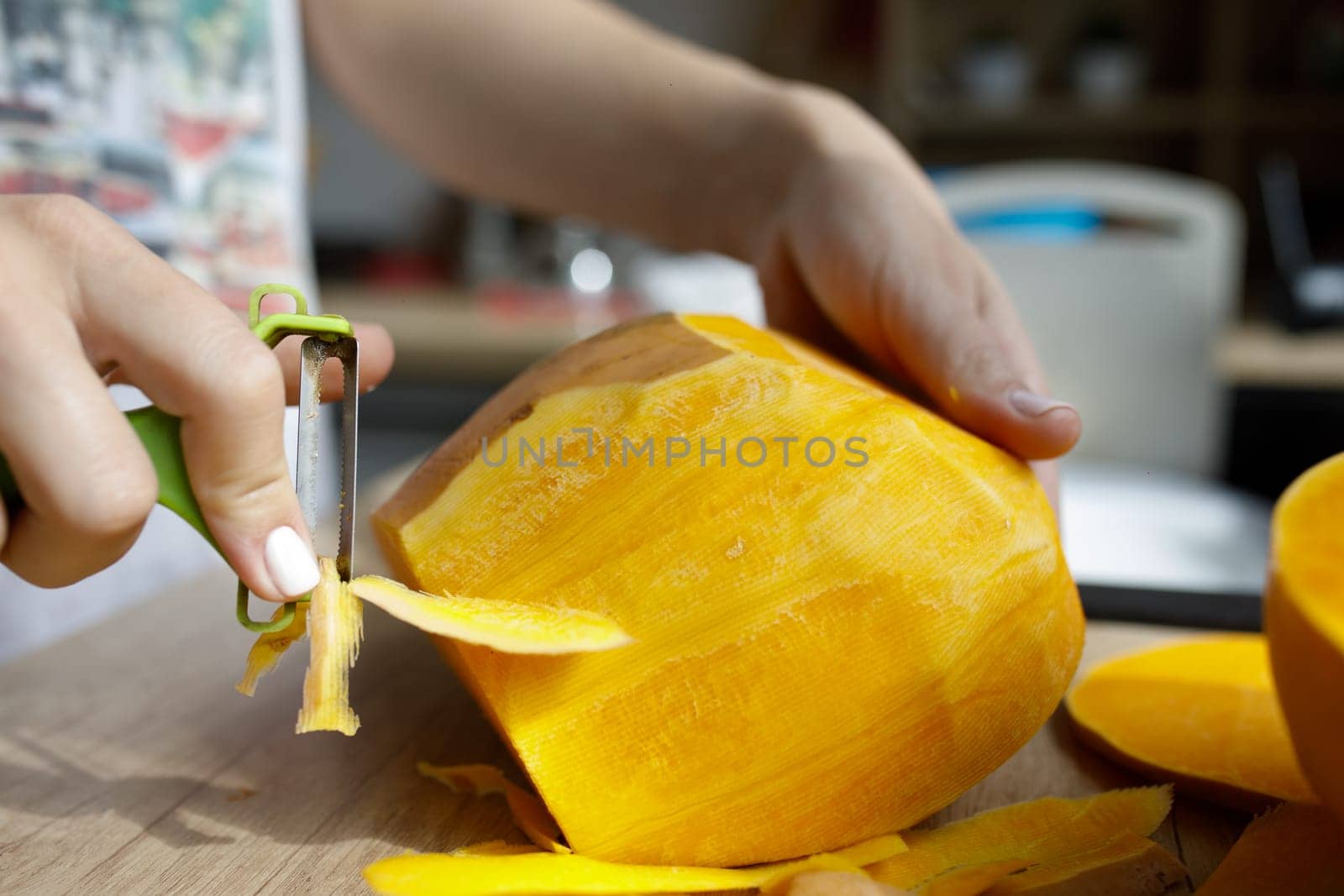 cut pumpkin many grains knife board hands. High quality photo