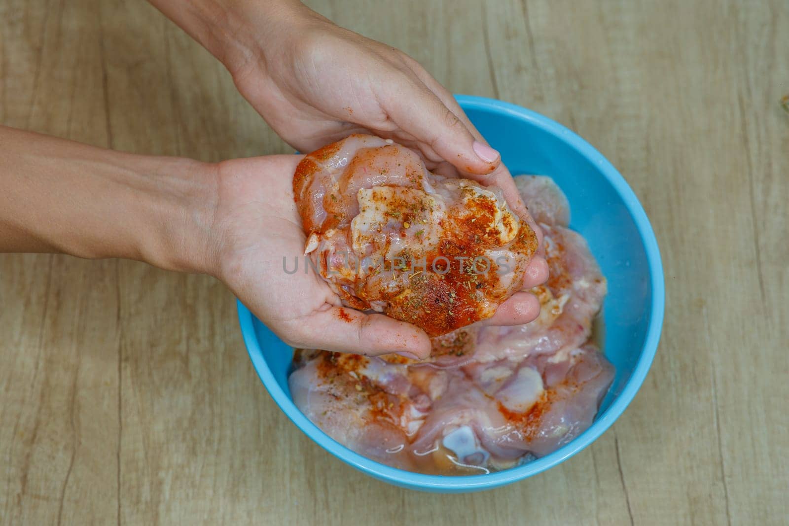 raw meat in hands with spices in a bowl. High quality photo