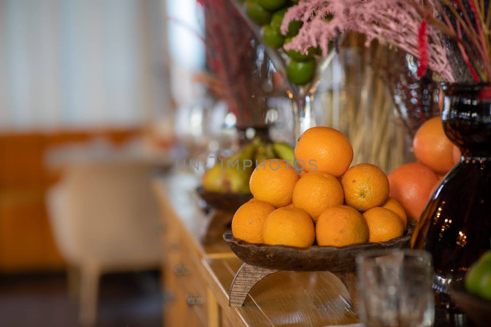 oranges in a bowl on a fruit table. High quality photo