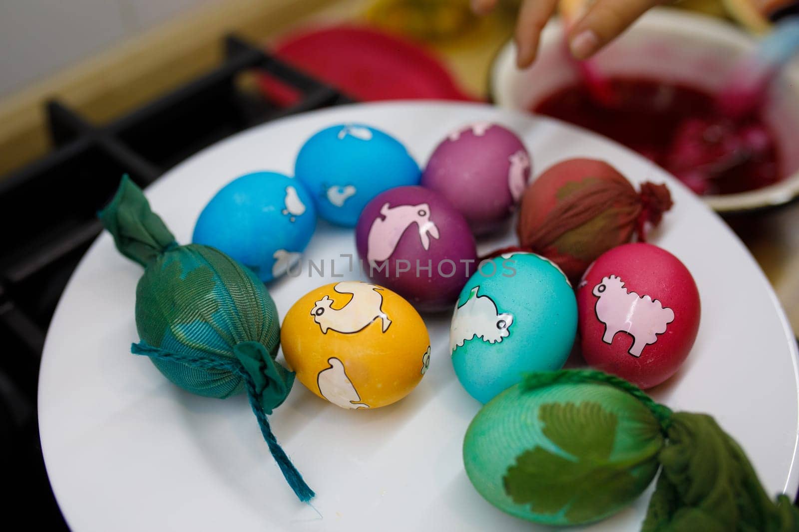 painted eggs with different colors on a plate. High quality photo