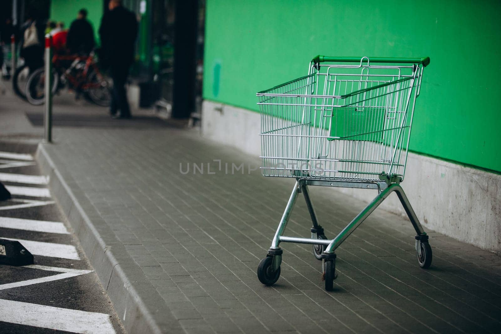 supermarket basket and green wall. High quality photo