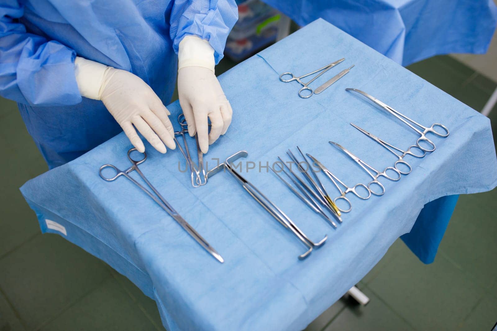 sterile instruments for surgery on the tray and hands. High quality photo