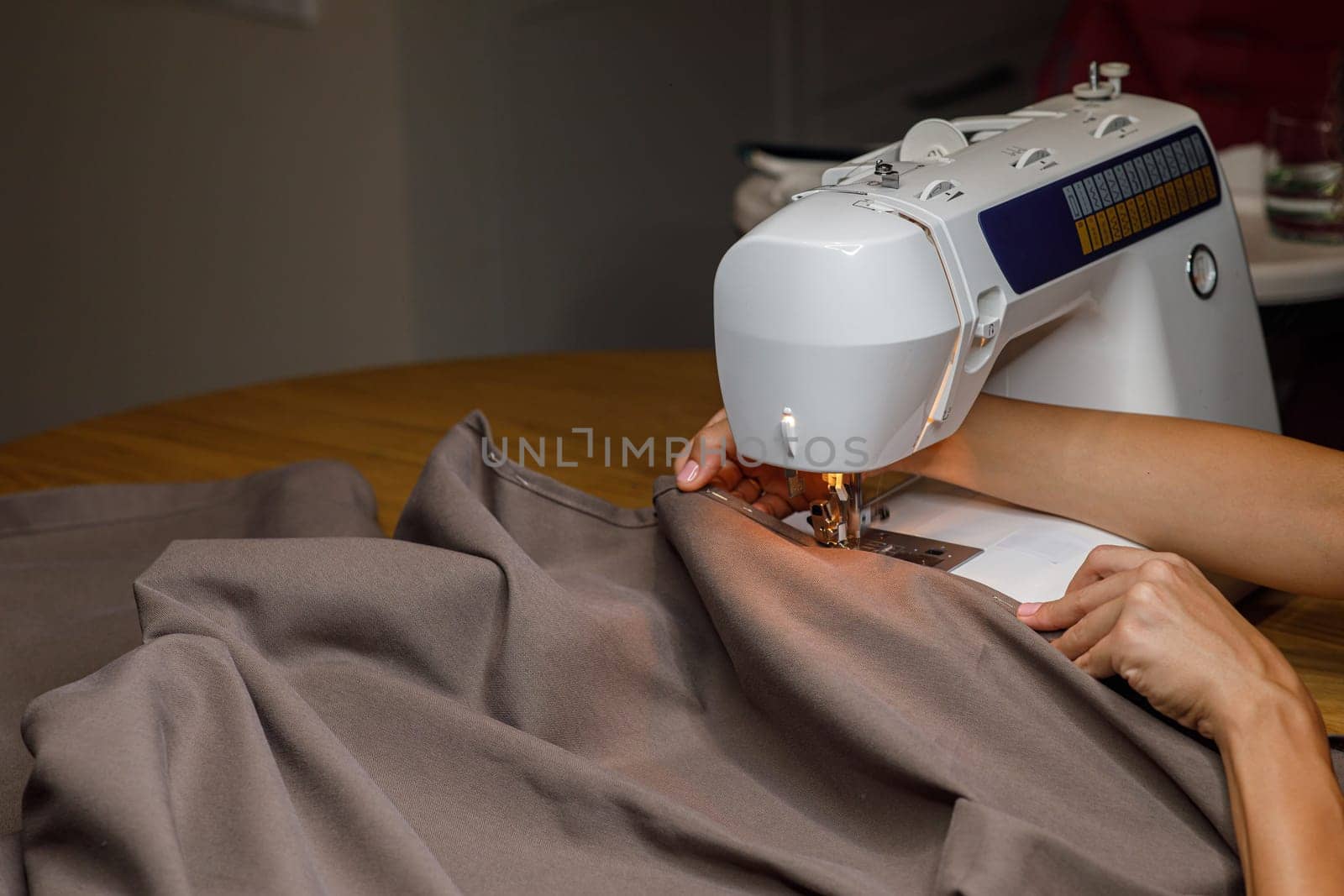 sewing machine, seamstress hand fabric. High quality photo