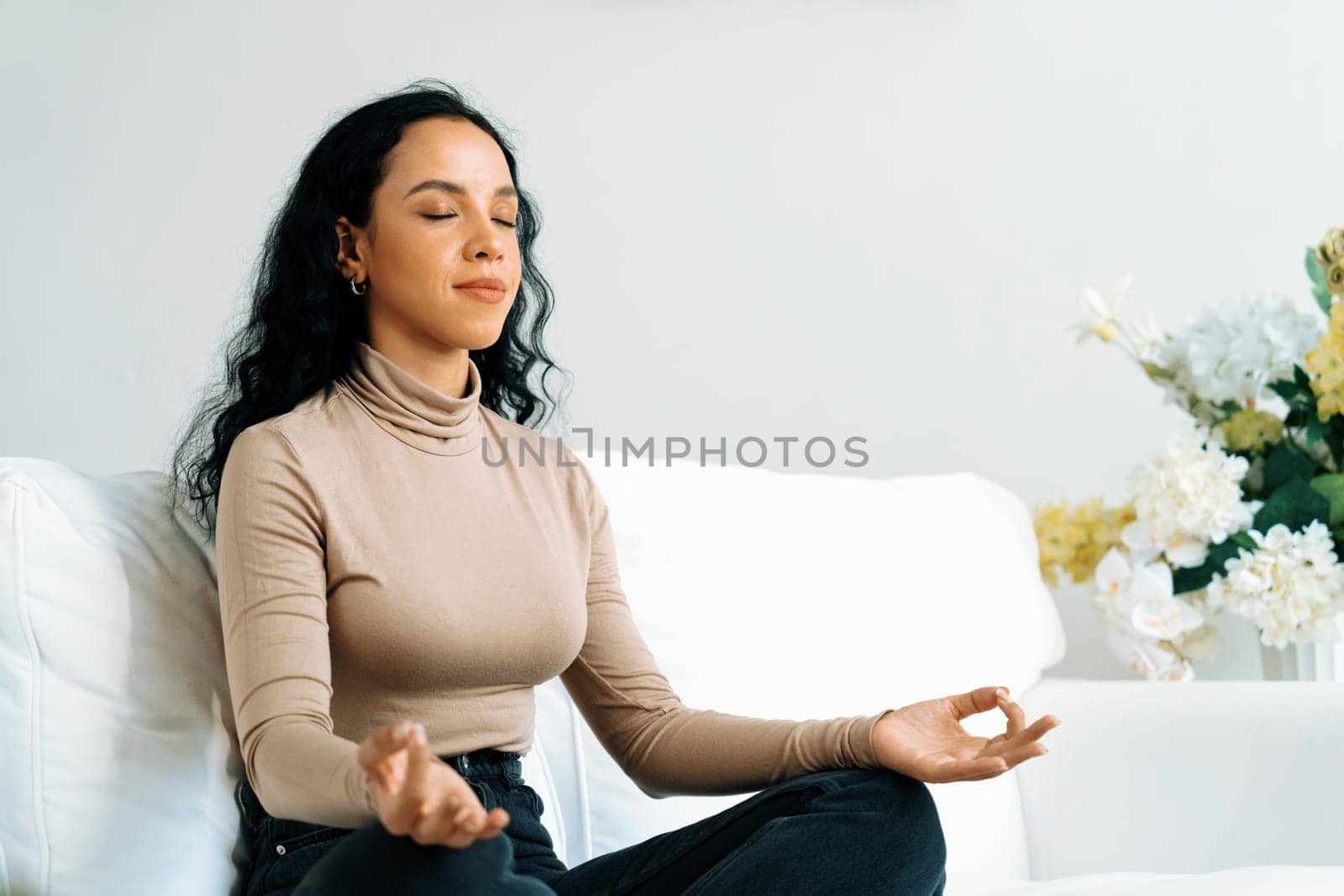 Young African American woman practice crucial mindful meditation at home by biancoblue