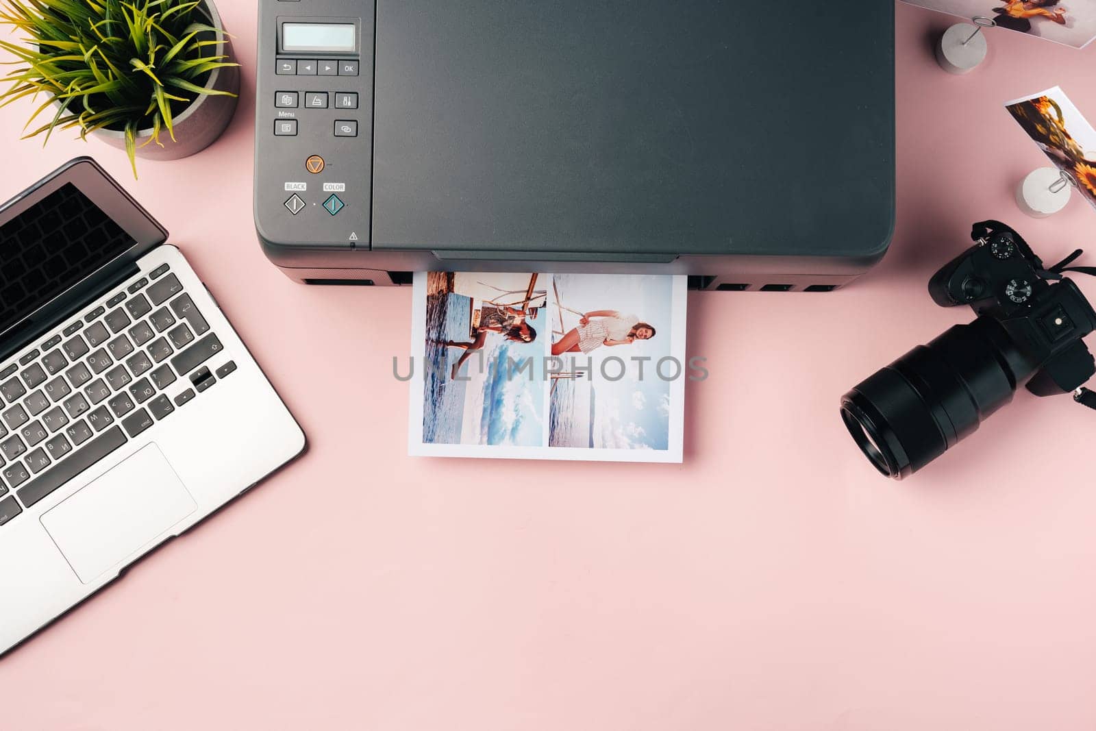 Printer, laptop and camera on table close up. Printing photos by Fabrikasimf