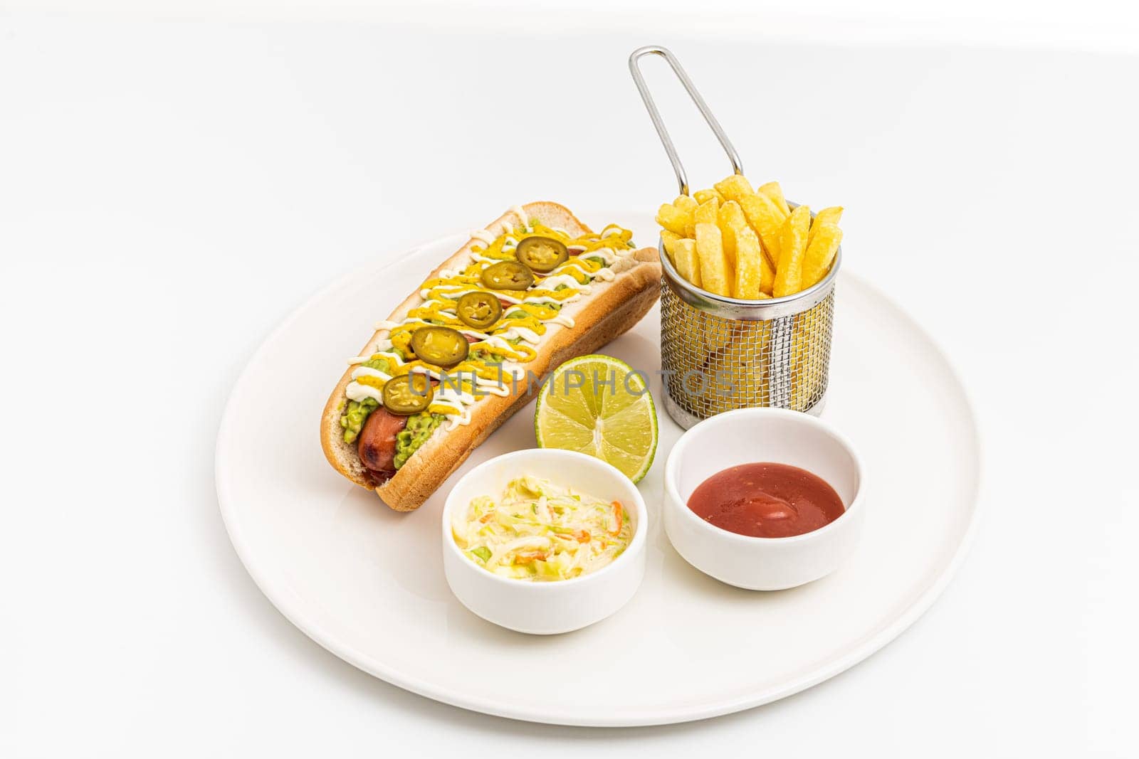 Delicious hot dog sandwich with sauces and fries on the side by Sonat