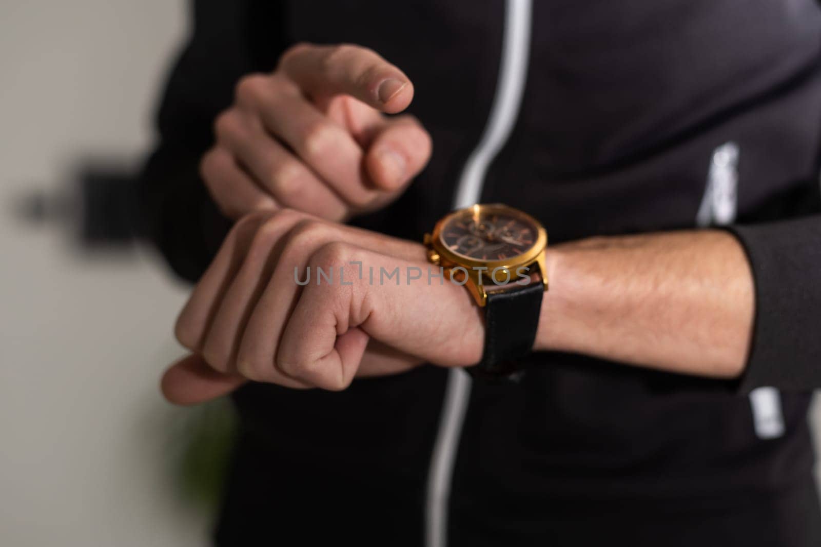 A watch on a man's hand of a man, a close-up of a man's watch on his hand.