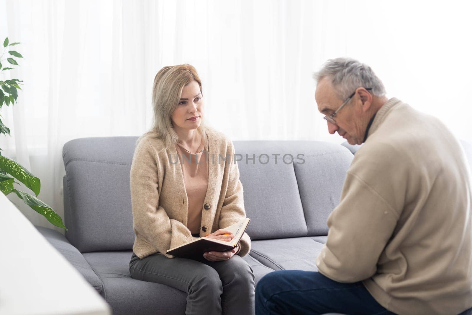 Image of young psychiatrist and her elder patient.