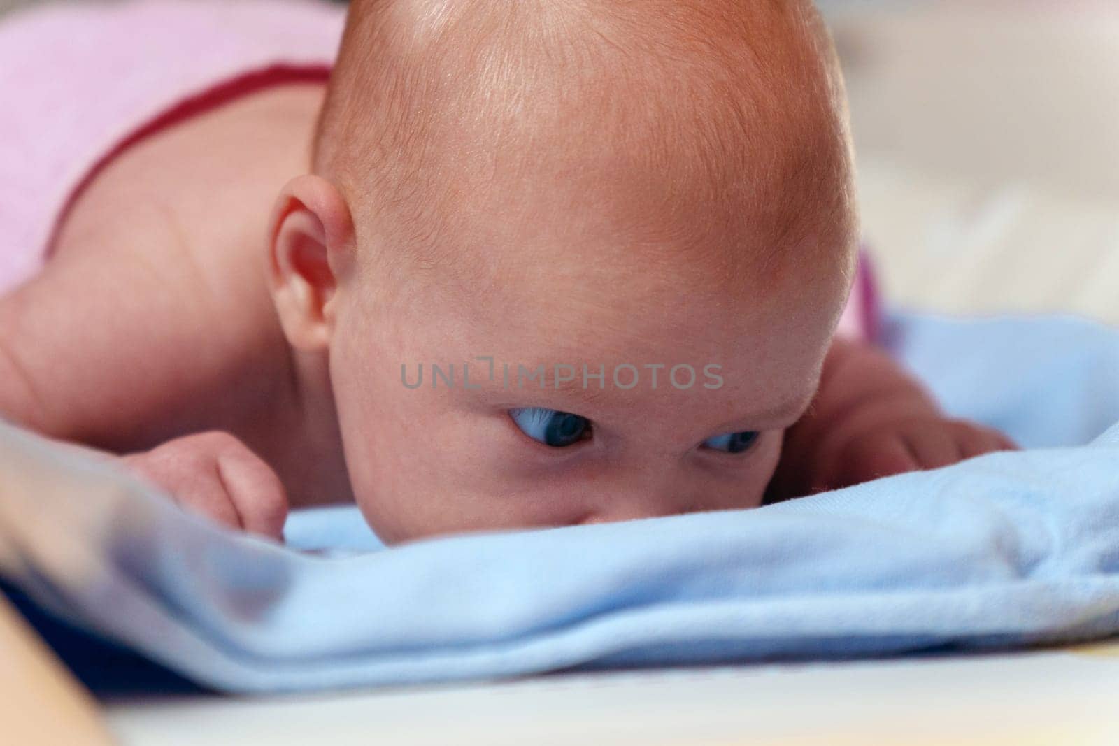 Early life, this close-up portrait reveals the tranquil beauty of a 2-month-old baby by darksoul72