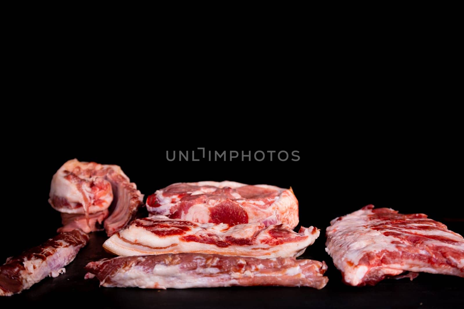 Different types of raw meat with fresh herbs. High quality photo