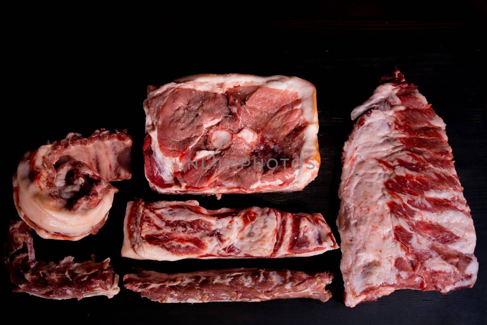 Different types of raw meat with fresh herbs. High quality photo