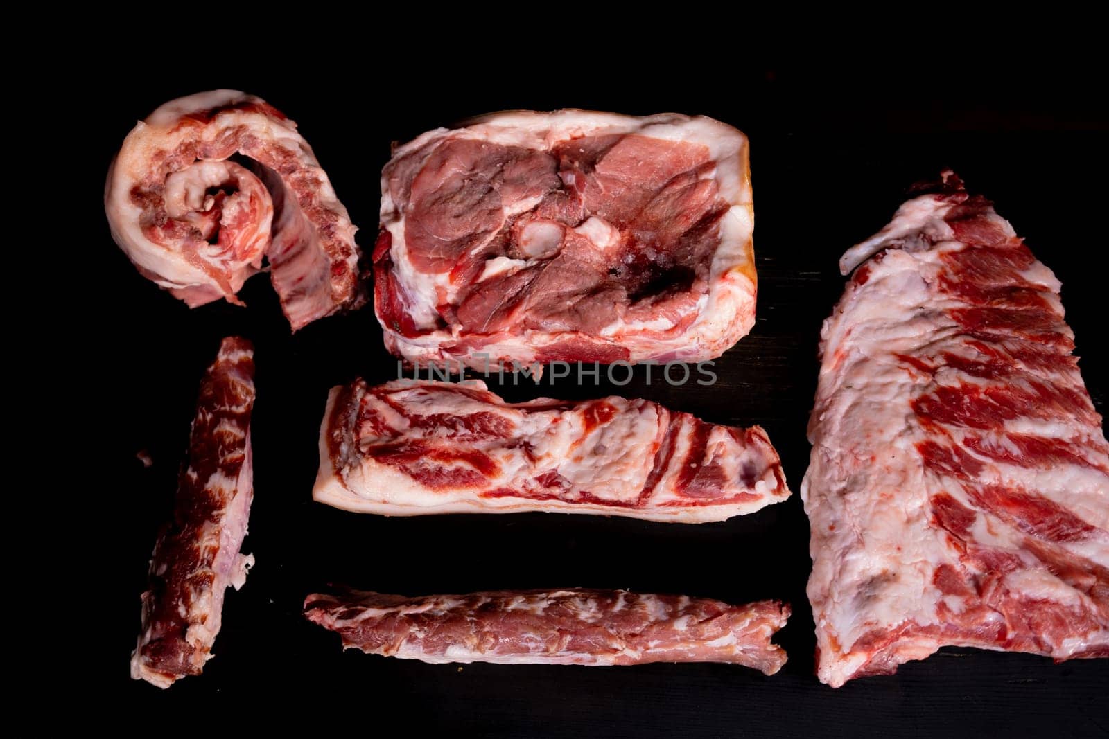 Different types of raw meat with fresh herbs. High quality photo