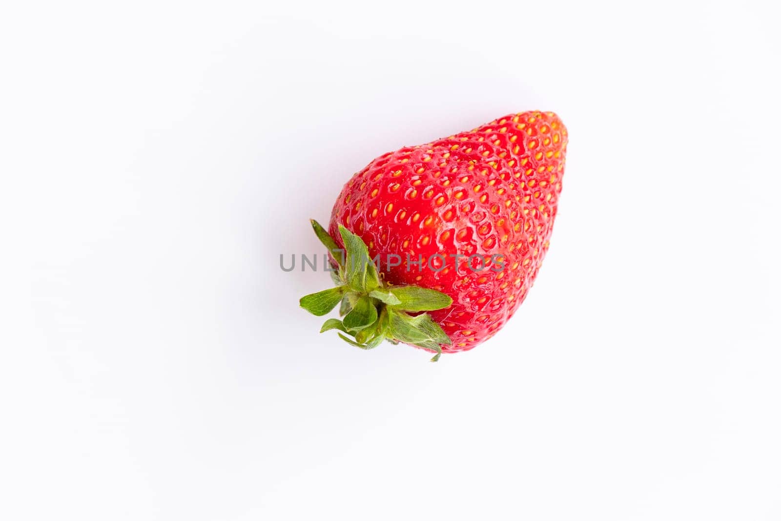 top view of red, ripe, juicy strawberries on a white background. by Leoschka