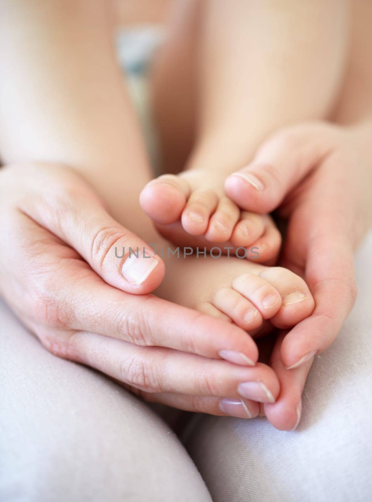 Love, person and hands with newborn or feet for development, nurture and bonding in nursery of apartment. Family, parent and baby toes with trust, support or care for relationship or closeup in home by YuriArcurs
