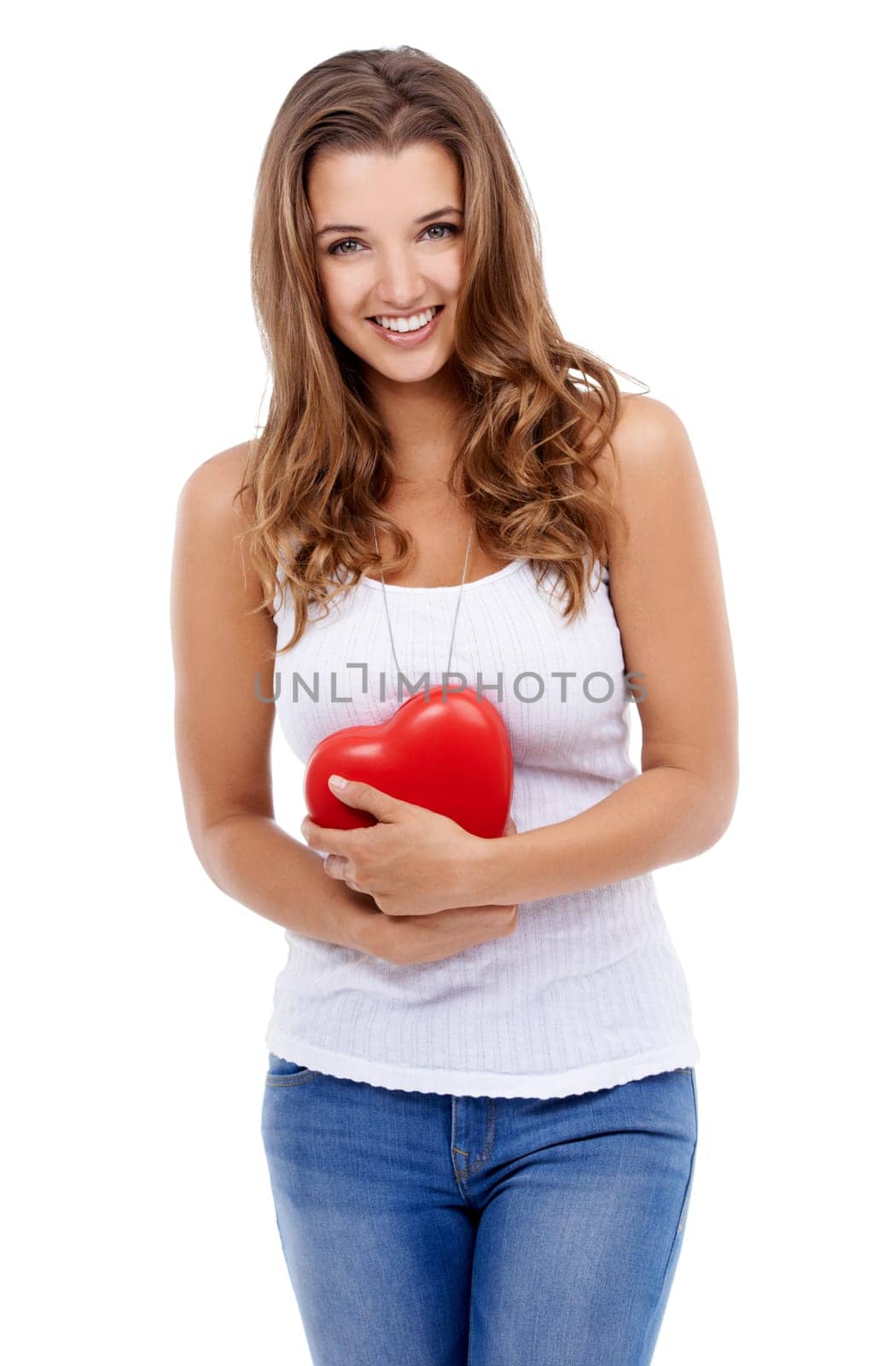 Woman, portrait and heart for love in studio, smiling and confidence with emoji on white background. Female person, happy and symbol for romance on valentines day, support and peace or kindness.