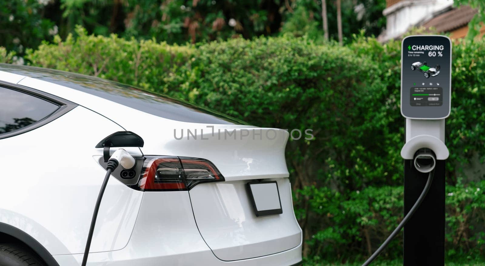 Electric vehicle technology utilized to residential home charging station for EV car battery recharge. Eco-friendly transport by clean and sustainable energy for future environment.Panorama Synchronos