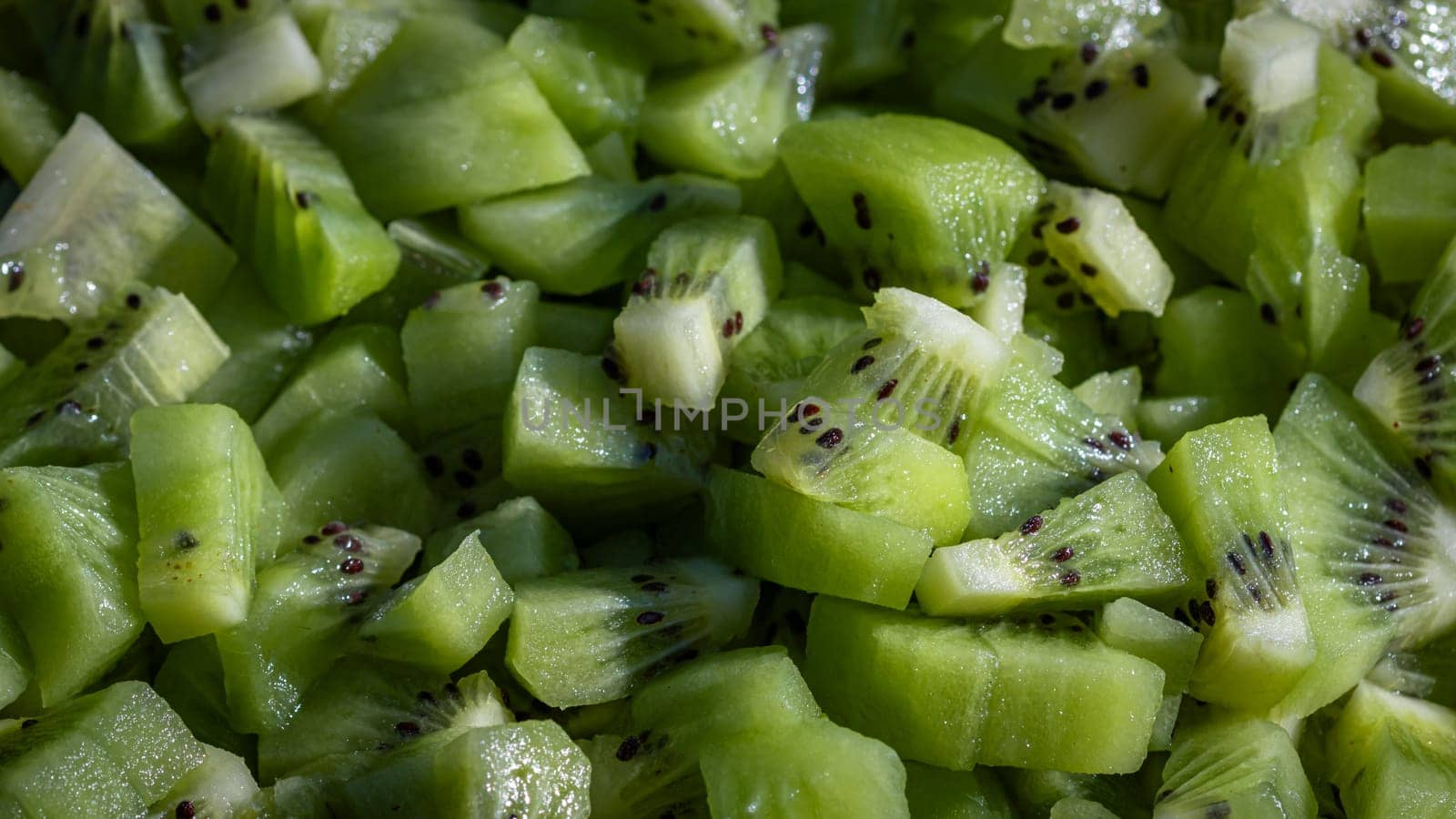 Ripe kiwi fruit. Detail of chopped exotic kiwi fruits used for desserts