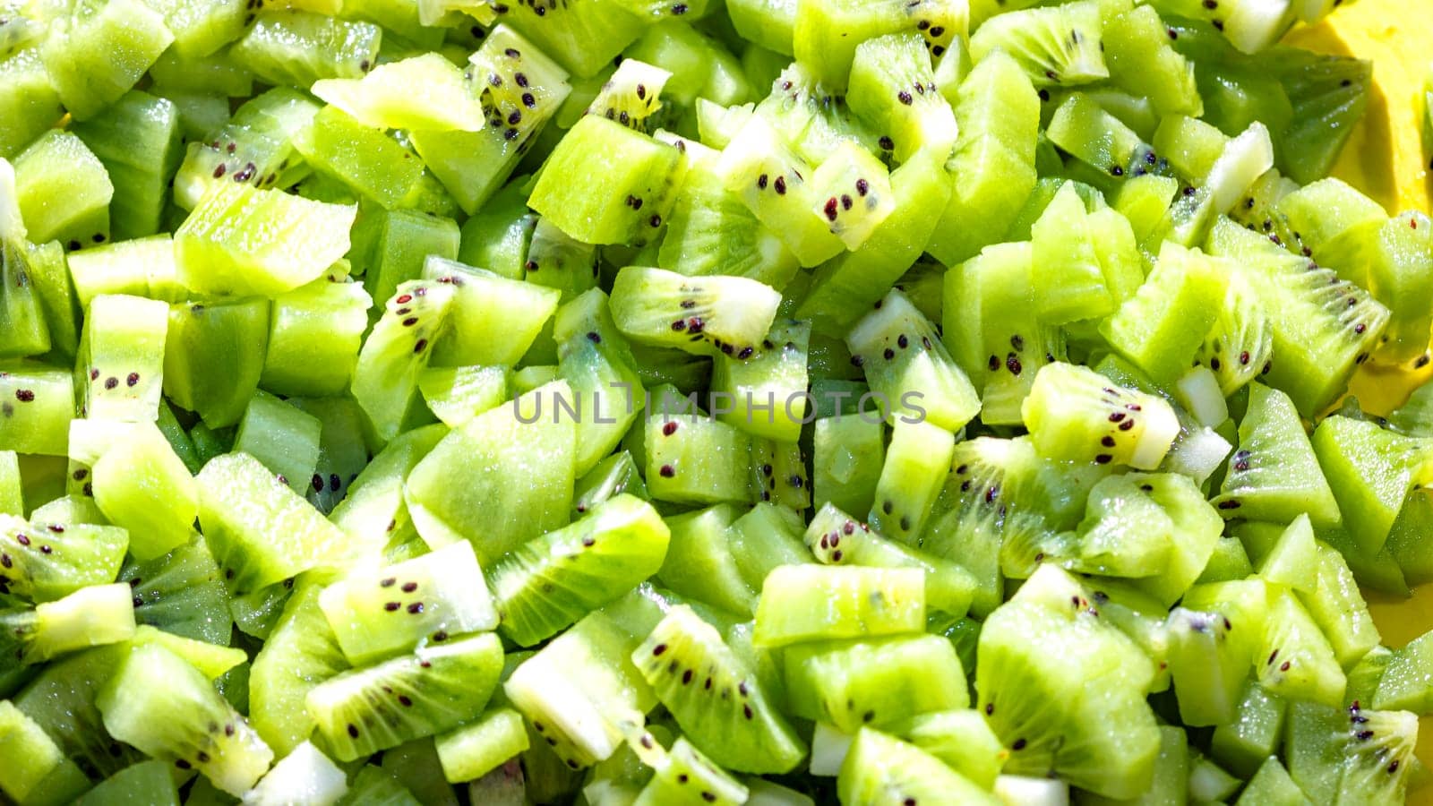 Ripe kiwi fruit. Detail of chopped exotic kiwi fruits used for desserts