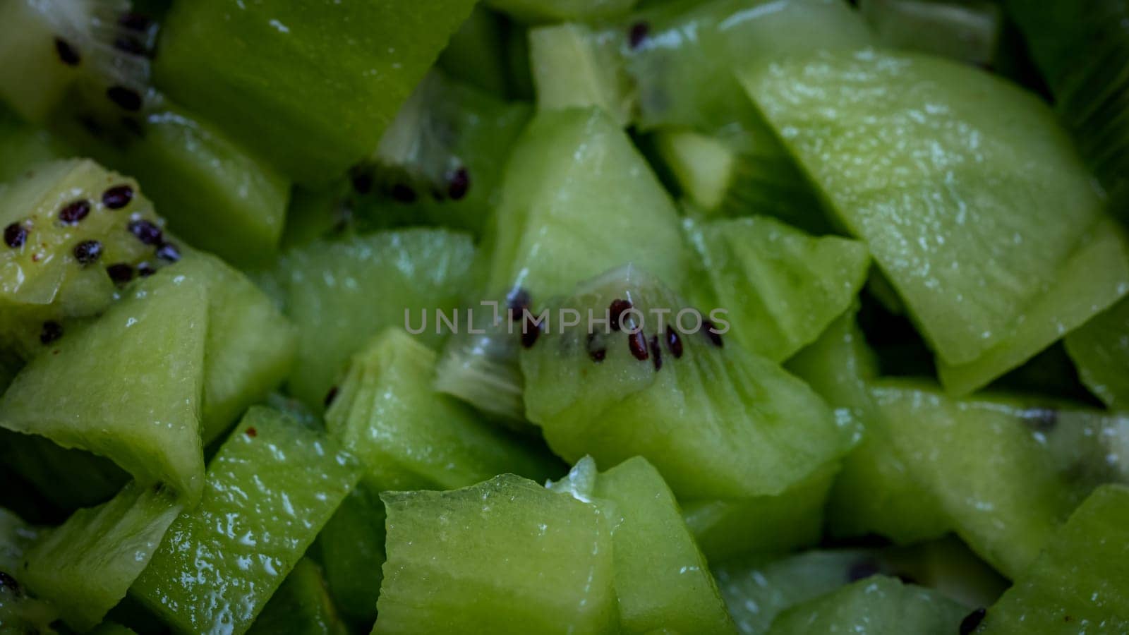 Ripe kiwi fruit. Detail of chopped exotic kiwi fruits used for desserts