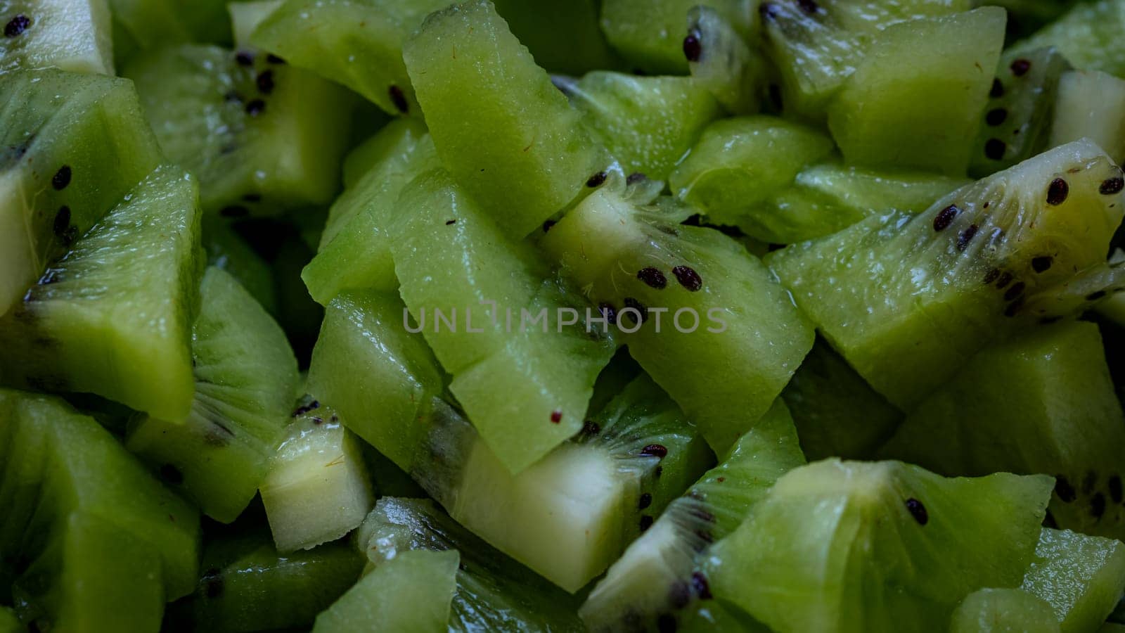 Ripe kiwi fruit. Detail of chopped exotic kiwi fruits used for desserts