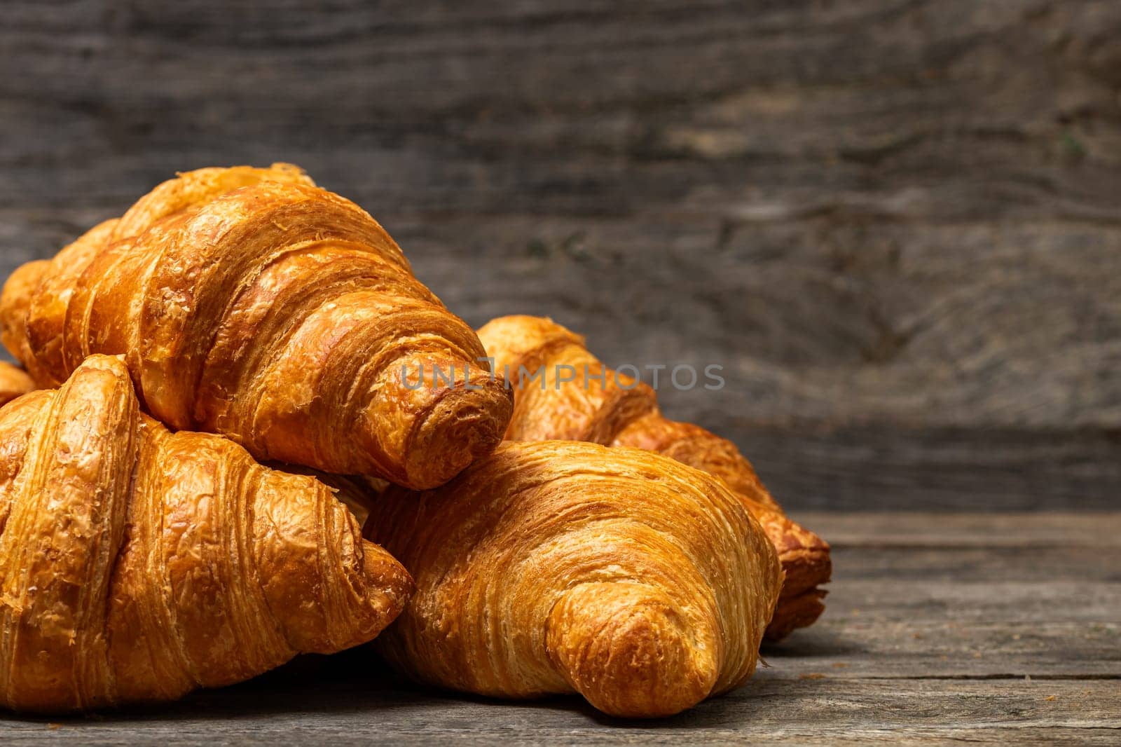 Fresh and delicious croissants isolated. French breakfast concept. by vladispas